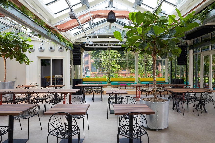 best hostels in milan, Combo Milano dining area with plants 