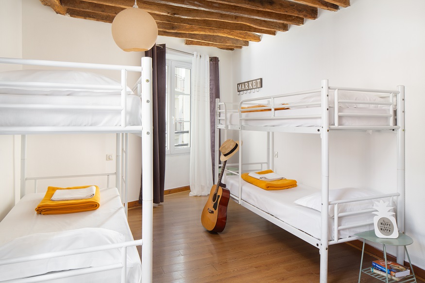 best hostels in paris, Le Village Montmartre by Hiphophostels dorm room with guitar