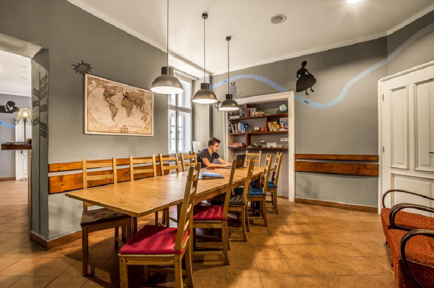 best party hostels in prague, tables and chairs at Ahoy! Hostel