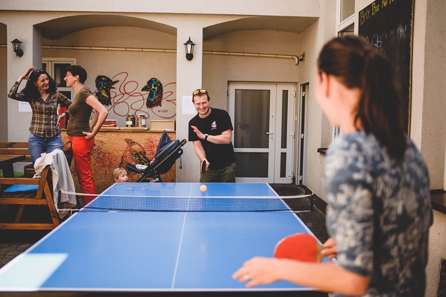 best party hostels in prague, people playing ping pong at Brix Hostel