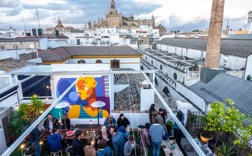 best hostels in seville, people on the rooftop at La Banda Rooftop Hostel