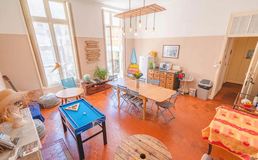 best hostels in nice, social area at La Maïoun Guesthouse with pool table and tables