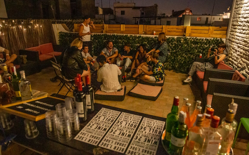 best hostels in seville, people on the roof terrace at Hostel One Catedral